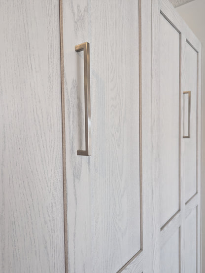 double oak murphy bed close up of brushed nickel pulls